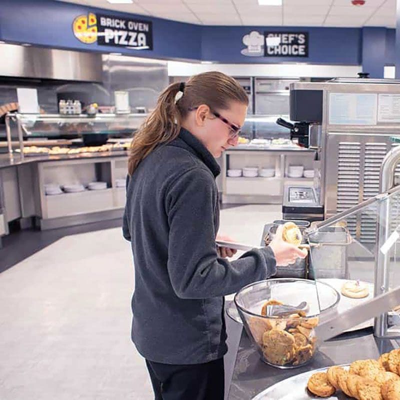 Student grabbing dessert
